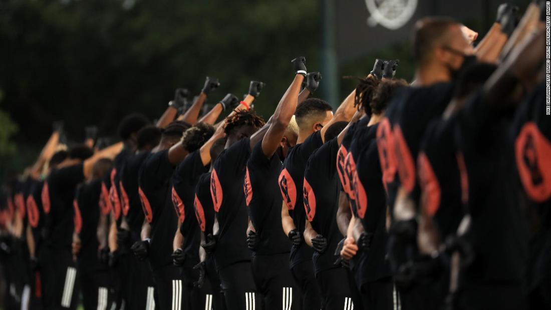Black MLS players raise gloved fists in racial justice
protest before first match 1