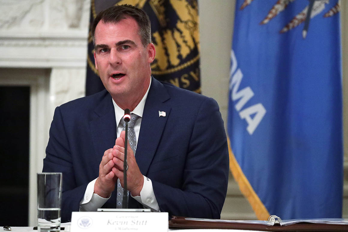 Oklahoma governor tests positive for coronavirus after
hosting Trump rally 1
