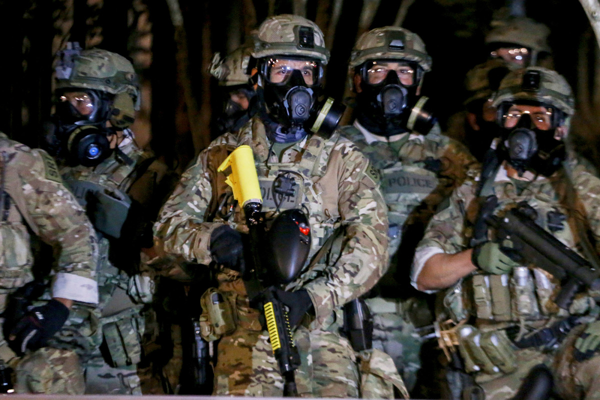 Oregon will sue federal agencies over use of force against
protesters 1