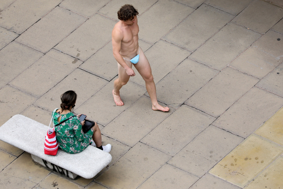 Man stuns Londoners by wearing a face mask — as a
G-string 1