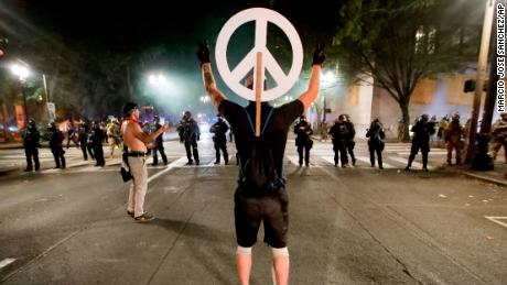 Detained Portland demonstrators are required to stay away
from future protests to get out of jail 1 Detained Portland demonstrators are required to stay away
from future protests to get out of jail 1
