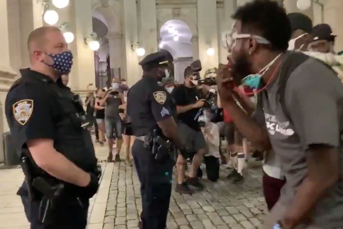 NYPD Police Retreat in the Face of Taunting City Hall
Protesters 1