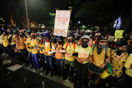 Portland protestors, Wall of Moms sue Trump administration
over use of tear gas, rubber bullets 1