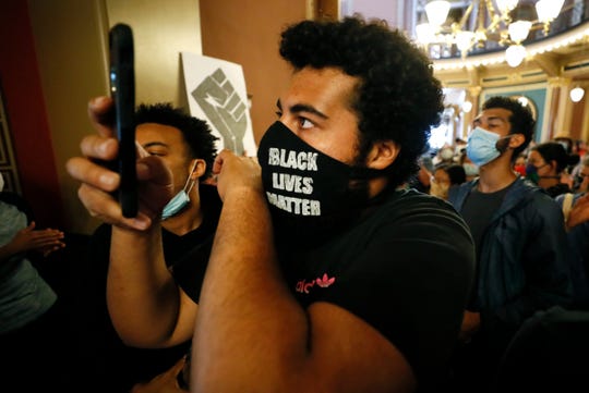 Iowa governor says her driver who struck Black Lives Matter
protester 'acted appropriately' 1