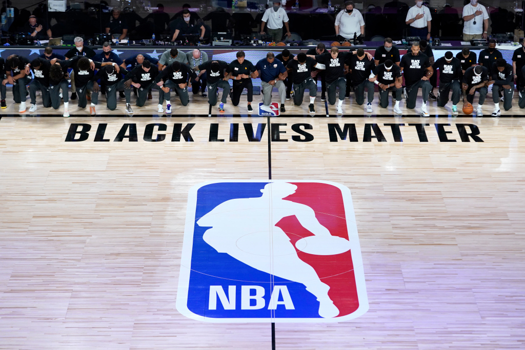 Players, coaches kneel before NBA’s re-opening night 1