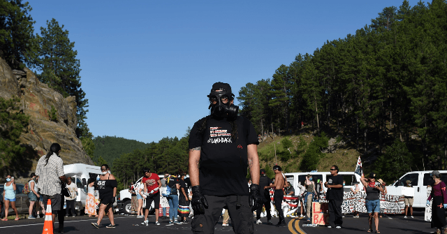 Protesters Block Road Leading to Mount Rushmore Independence
Day Celebration with Disabled Vehicles 1