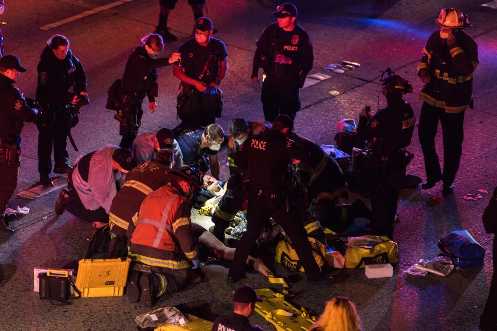 1 of 2 protesters hit by driver on Seattle freeway
dies 1
