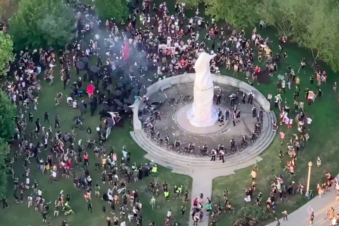 'Columbus Was a Murderer!' Rioters Shout as They Shoot
Fireworks at Police in Chicago 1