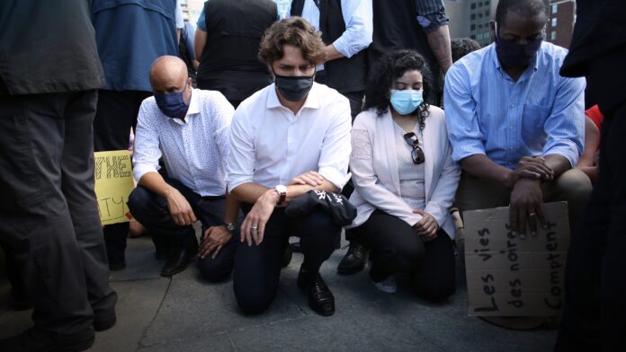 Trudeau Accused of ‘Humiliating’ RCMP by Kneeling at
Anti-racism Protest, Former Police Officer says 1