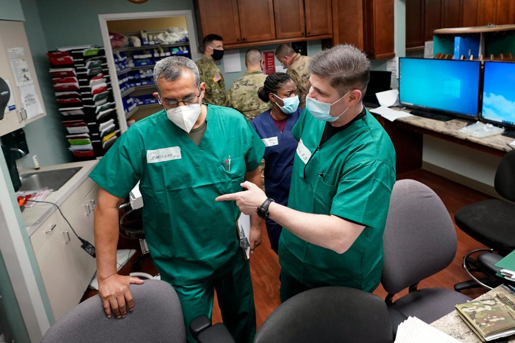 As COVID-19 surges in some U.S. states, emergency rooms
swamped 1