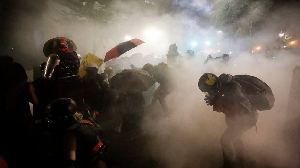 Police and protesters clash in violent weekend across the
US 1