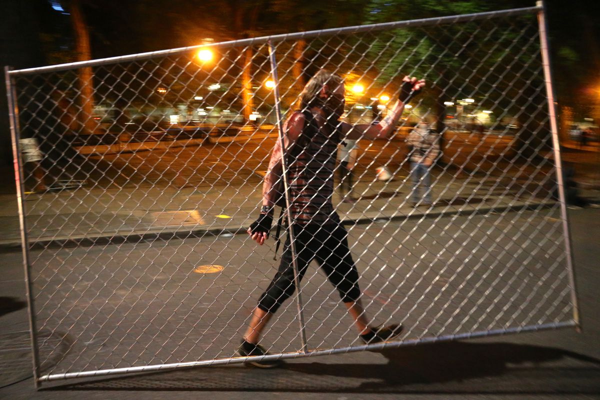 Portland police union HQ briefly burns, officials deploy
tear gas as protests rage on 1 Portland police union HQ briefly burns, officials deploy
tear gas as protests rage on 1