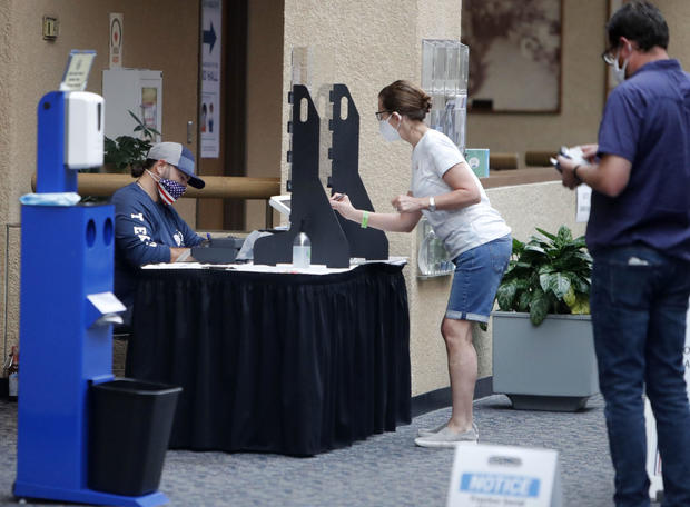 Texas voters go to the polls for runoffs amid coronavirus
spikes 1