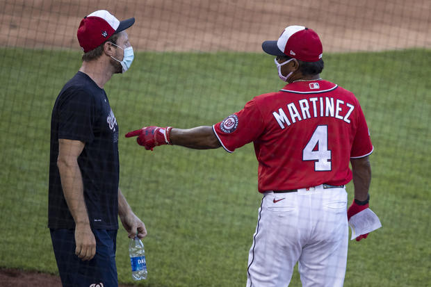 Opening day: Empty parks, fake crowd noise and air
high-fives 1
