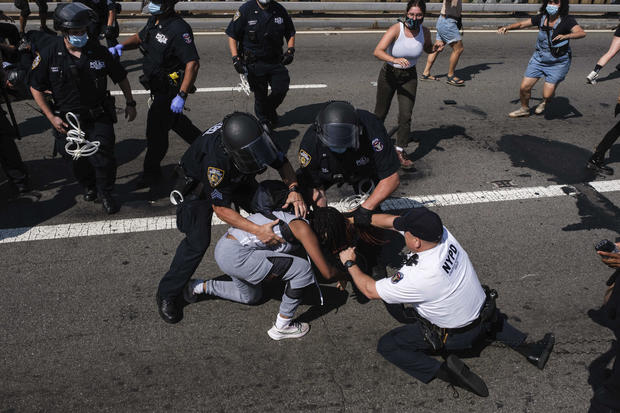 NYPD chief among officers injured at Brooklyn Bridge
protest 1