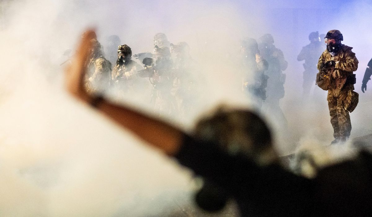 Feds use tear gas to try to disperse rowdy Portland
protests 1