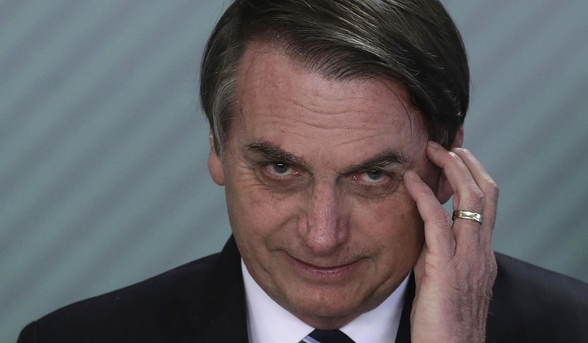 Brazil's Bolsonaro says he will be tested for
COVID-19 1