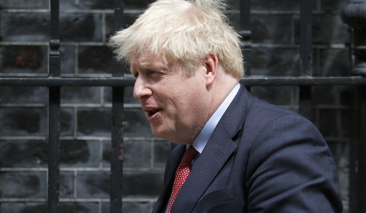 UK's Johnson preps for new COVID wave but eyes more
opening 1