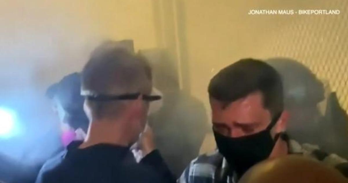 Portland mayor tear-gassed by federal agents during
protest 1