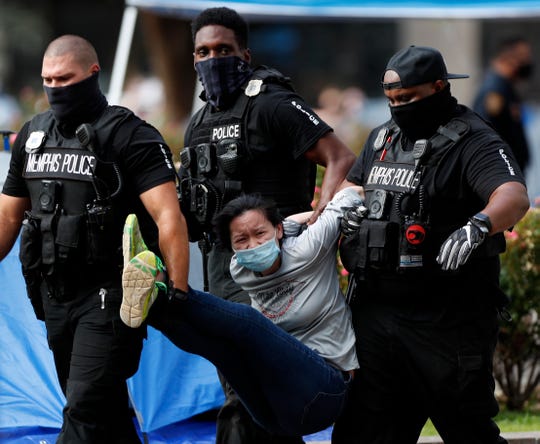 Memphis police clear downtown plaza, detain protesters who
camped out for two weeks 1