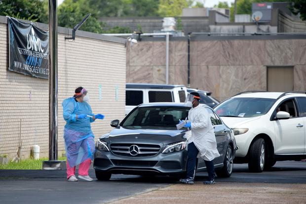 U.S. reports 63,200 new coronavirus cases, another daily
record 1