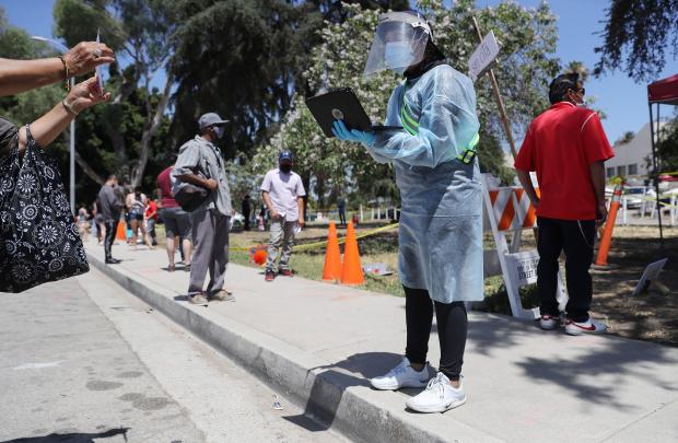 U.S. reports a record 60,000 new coronavirus cases in one
day 1