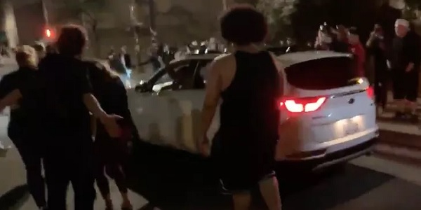 Portland rioters surround car, driver shoots his way
out 1