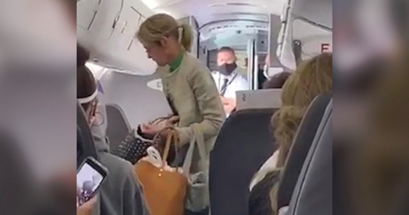 Video: Passengers Cheer As ‘Karen’ Is Kicked off Plane For
Refusing To Wear Mask 1