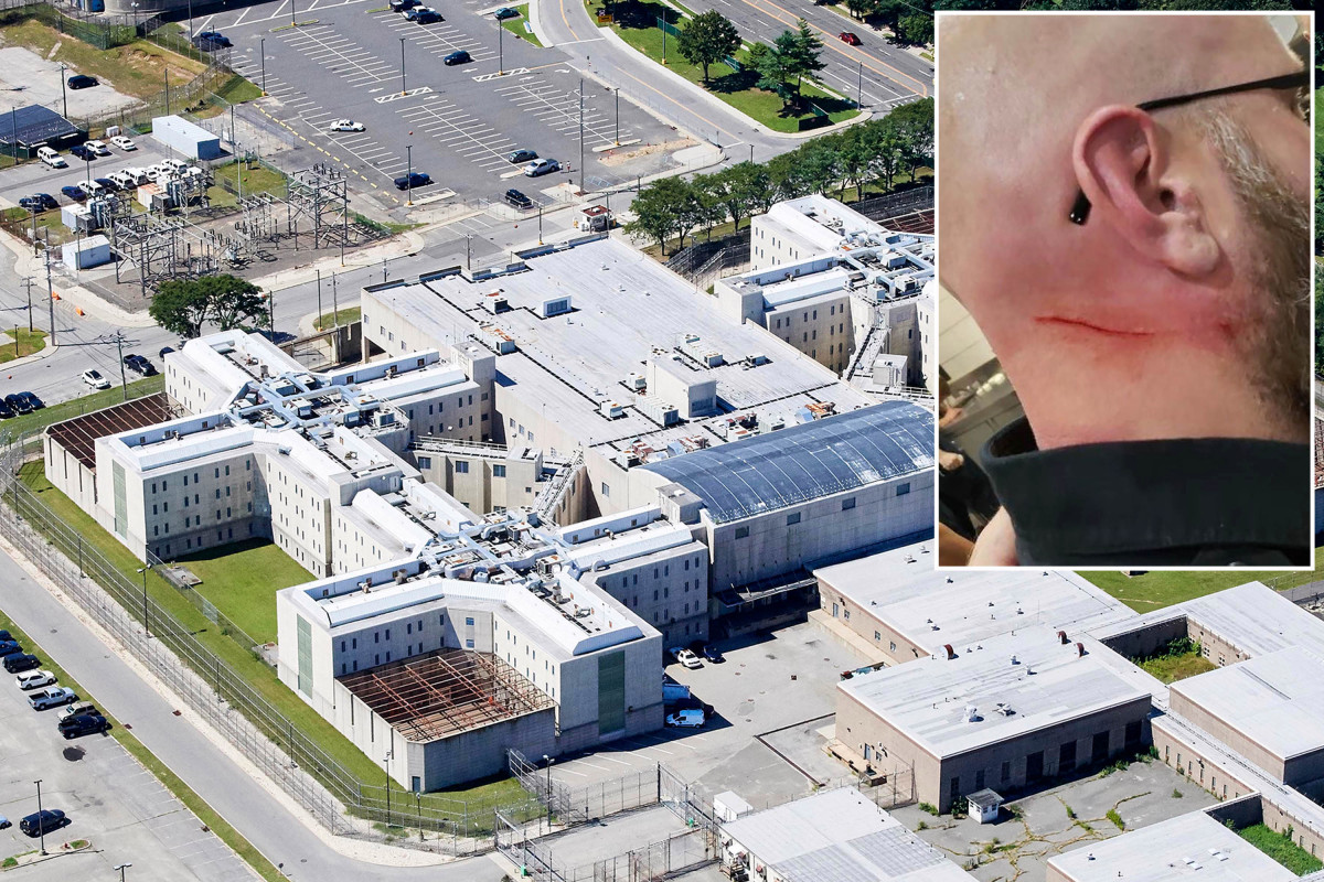 Nassau County correction officer slashed by gang member he
was transporting to cell 1