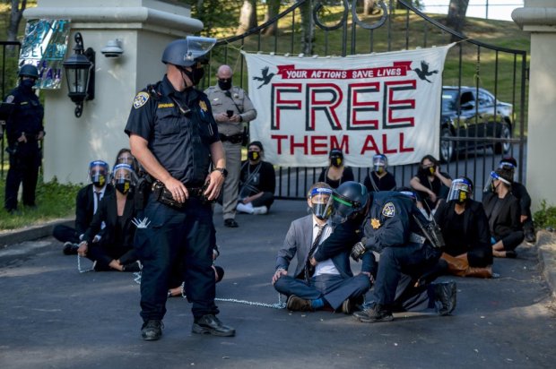 Protesters chained to Gov. Newsom’s home as prison deaths
mount 1