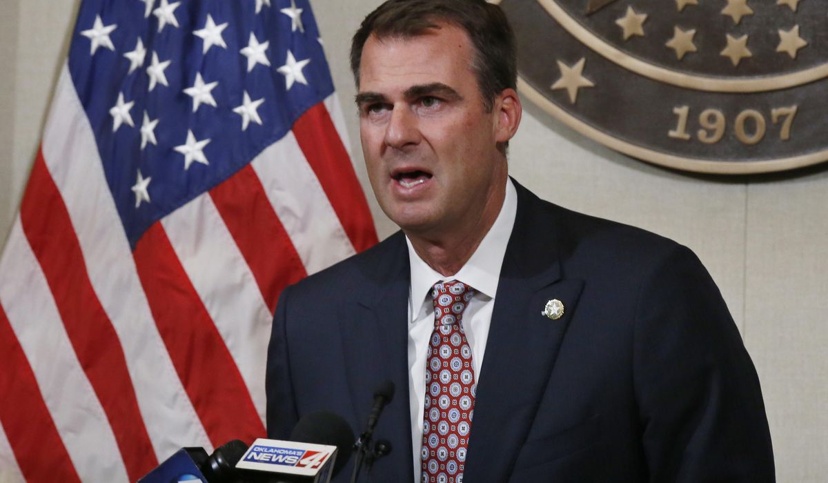 Oklahoma governor returns to office after 2-week
quarantine 1
