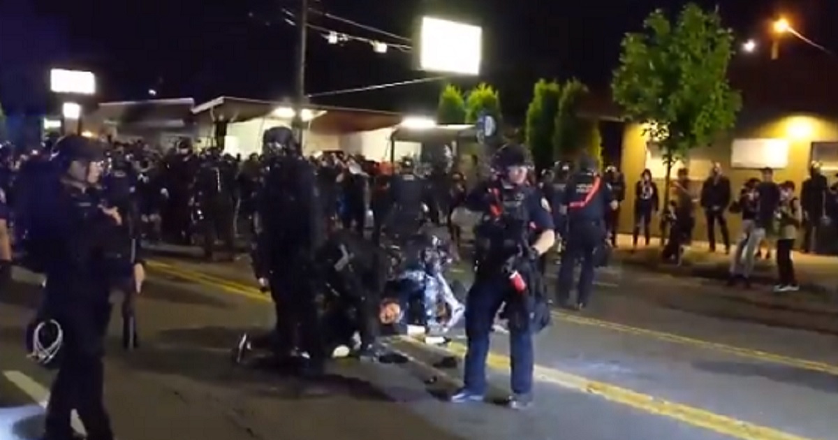 Portland Mayor Blames DHS for Violence in His City, Demands
Agents Clean Up Rioters’ Graffiti 1