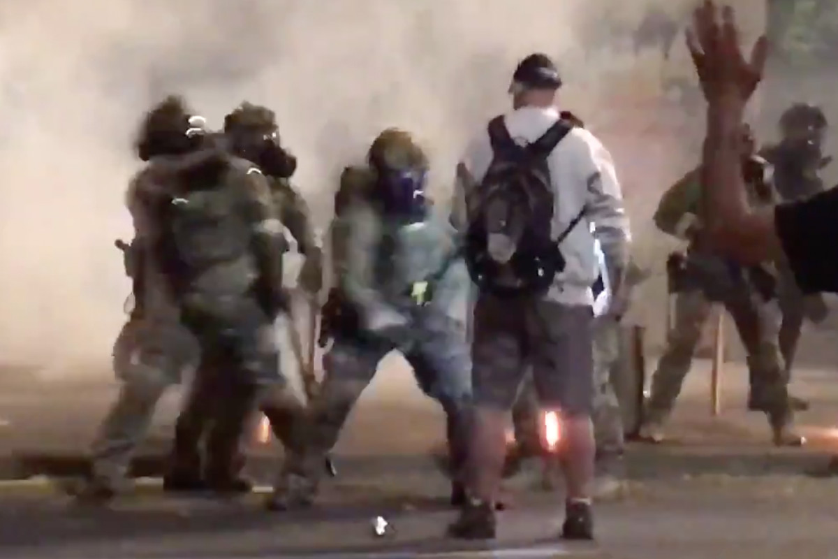 Portland protester appears unfazed by baton beating, pepper
spray in wild video 1