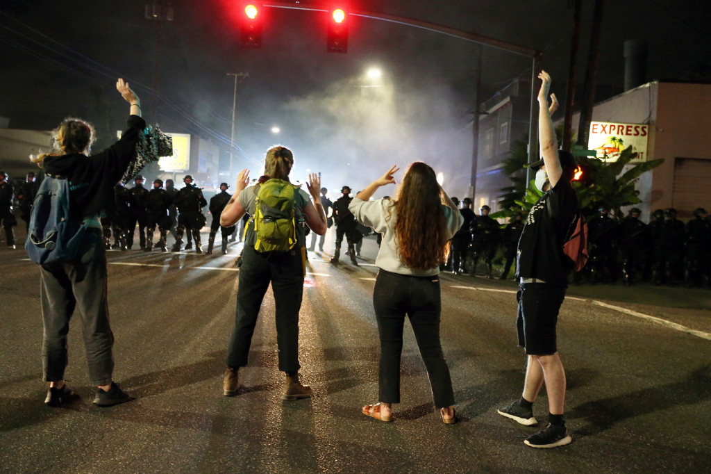 Portland police declare riot as protests turn violent
again 1