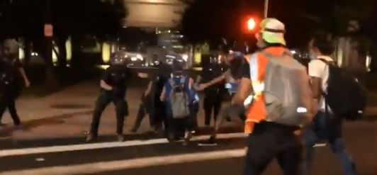 Denver police clash with protesters, arrest 6 in Civic
Center scuffle Wednesday night 1