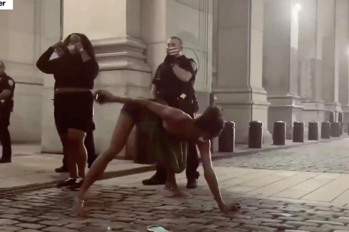 Protester twerks at cops during Occupy City Hall
demonstration 1