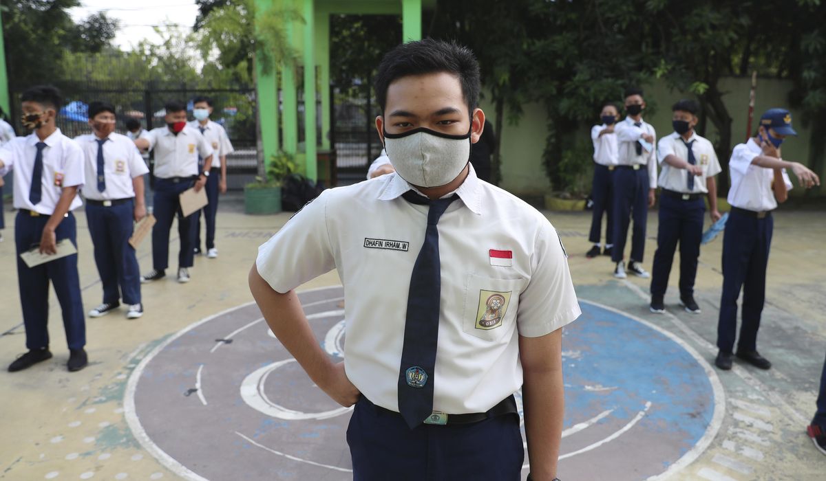 The Latest: India adds over 28,000 new coronavirus
cases 1