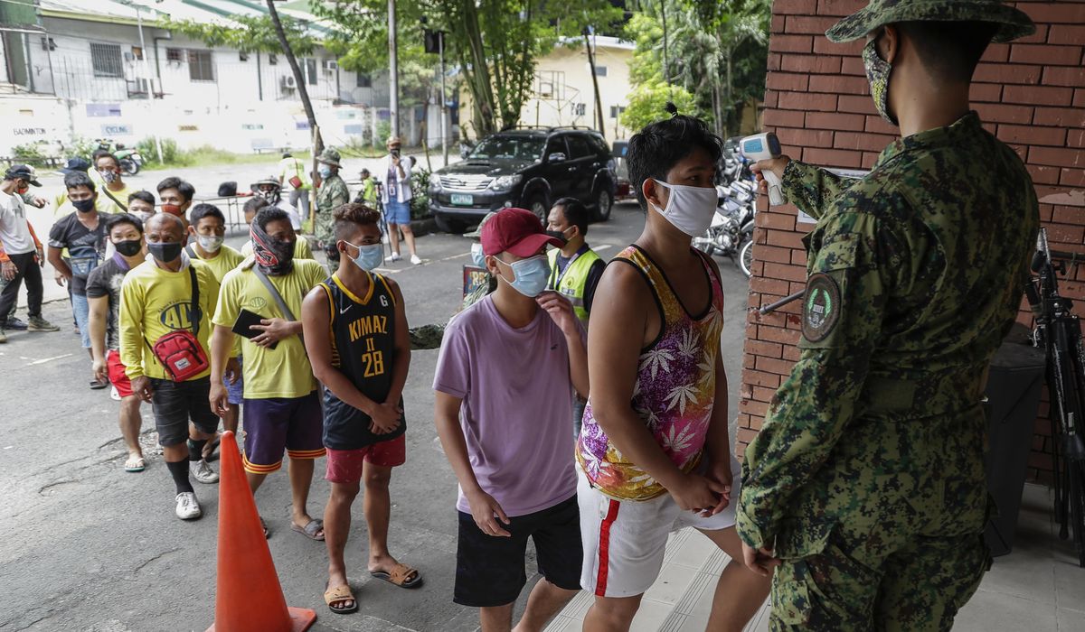 Philippines virus cases soar past 50,000 as lockdown
eases 1