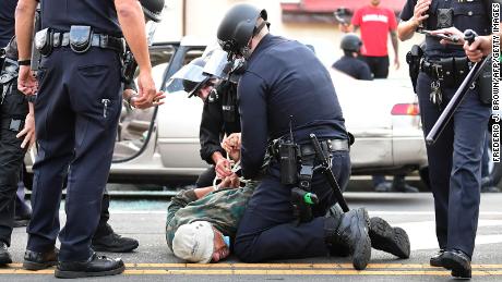 LAPD releases video showing protester shot in head with
'less-lethal' round 1
