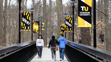 Universities across US halt in-person classes and begin
campus monitoring after rising virus cases 1