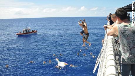 Coast Guard Watch opens fire on shark to protect crew in the
water 1