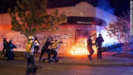Portland mayor calls for peace as protests near 100
days 1