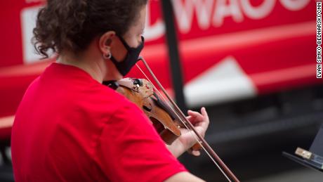 Unable to open its concert hall, New York Philharmonic
brings its music to the streets 1