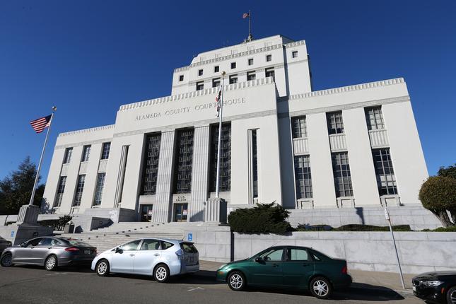 As defendant took stand to claim self-defense in 2017
Oakland killing, a juror was excused for contact with person who
tested positive for COVID-19 1