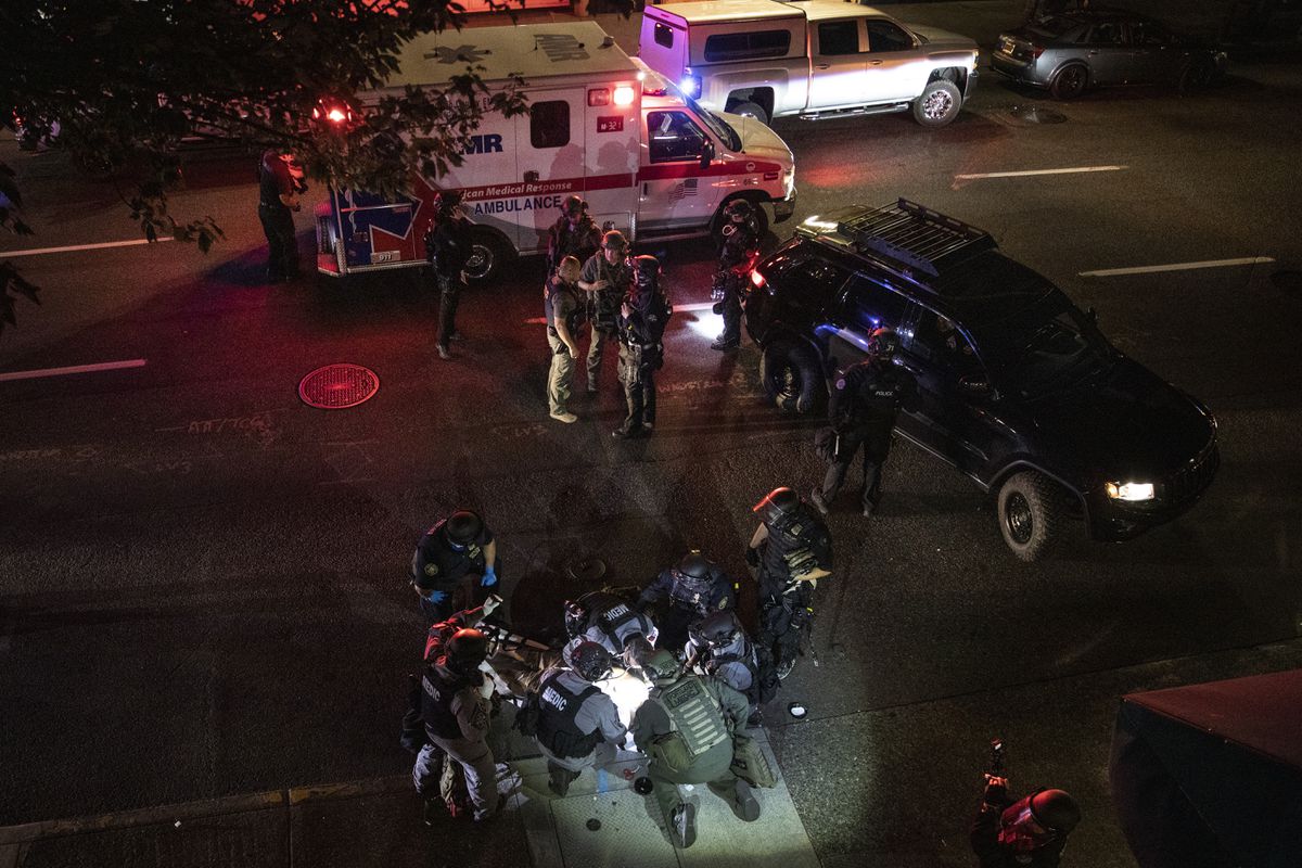Oregon governor orders state troopers to Portland after
fatal protest shooting 1 Oregon governor orders state troopers to Portland after
fatal protest shooting 1