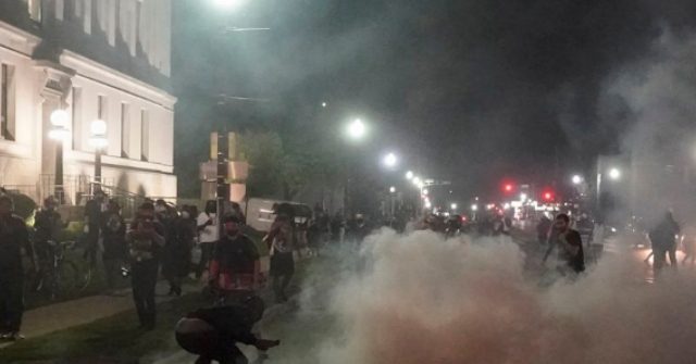 WATCH: Kenosha Rioters Hurl Bottles, Shoot Fireworks at
National Guard 1