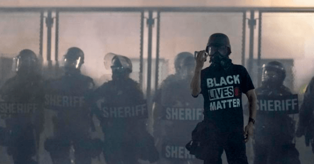 Police: Protesters Shatter Windows, Graffiti Buildings in
Sacramento 1