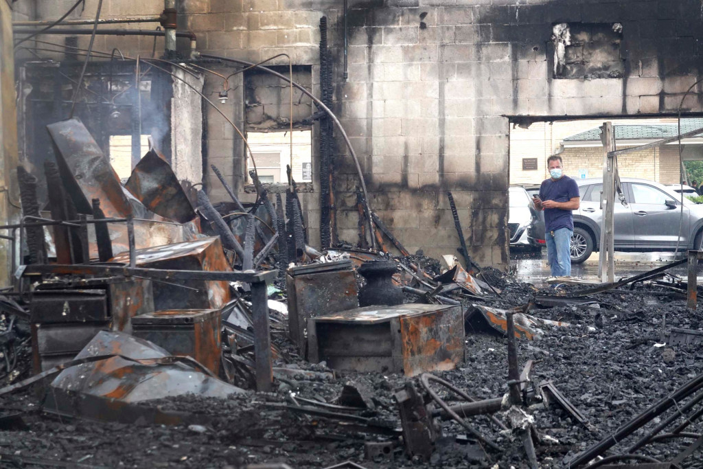 Store owner sobs after business of 40 years is burnt down
during Kenosha riots 1