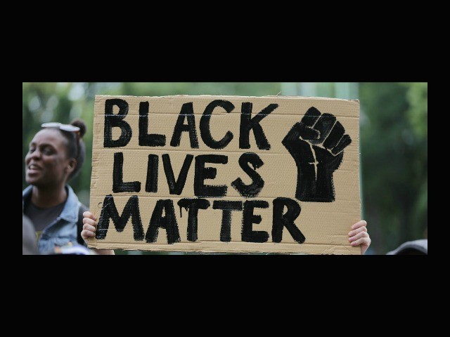 Child Raises Fist to Support Black Lives Matter as Demanded
by D.C. Protesters 1