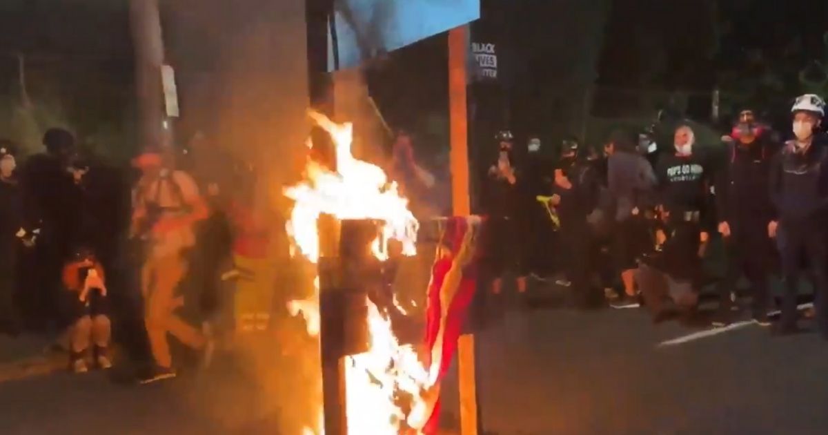 Antifa Rioters Bring Out Guillotine, Burn American Flags
Outside Police Building 1